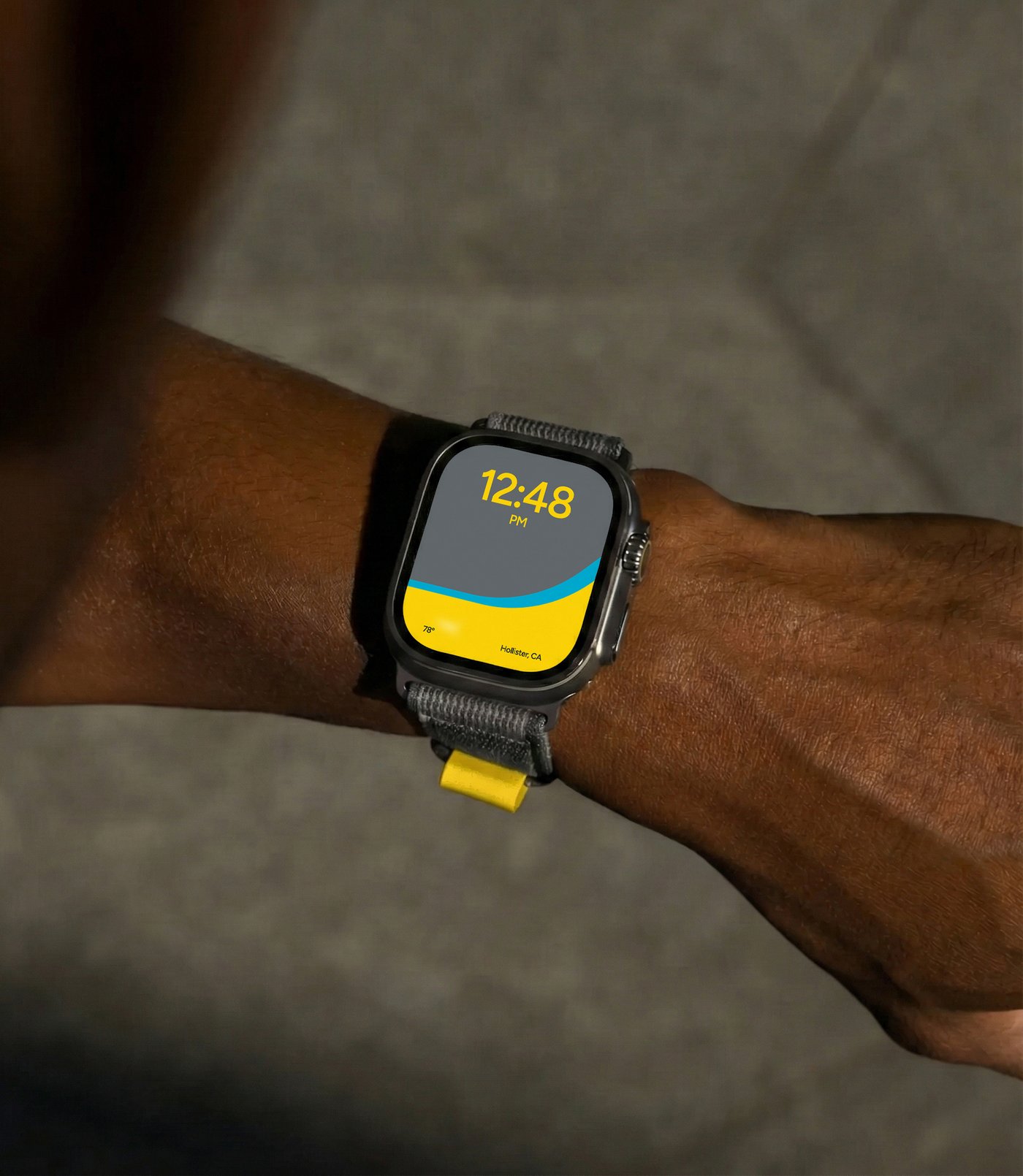 Wisk watch face showing 12:48 PM in Hollister, CA, on a wrist
